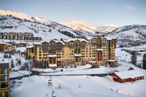 a resort in the mountains with snow on the ground at Grand Summit Lodge by Park City - Canyons Village in Park City