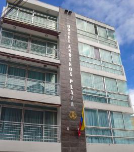 a building with a hotel sign on the side of it at Hotel Andinos Plaza Pitalito in Pitalito