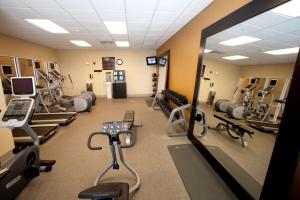 a gym with several treadmills and cardio machines at Hilton Garden Inn Valdosta in Valdosta