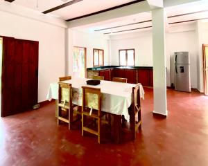 a kitchen with a table and chairs in a room at Minca Santa Marta Casa Scalea in Minca