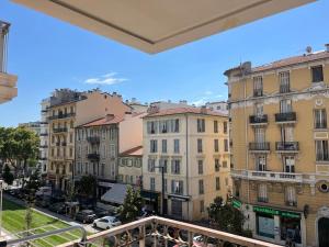 a view from a balcony of buildings in a city at Le Californie YourHostHelper in Nice