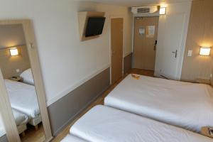 Letto o letti in una camera di Première Classe Lyon Sud - A7