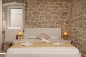 Кровать или кровати в номере Šibenik Style Suites