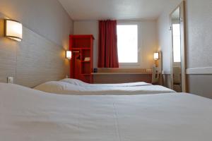 Letto o letti in una camera di Première Classe Lyon Sud - A7