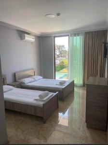 Postel nebo postele na pokoji v ubytování Hotel Mia