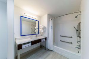 a bathroom with a sink and a mirror and a shower at Hampton Inn & Suites Pryor, Ok in Pryor +20 photos