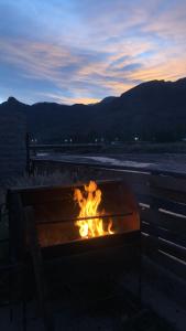 a fire pit with a view of the mountains at REMODELAMOS casa sobre el rio a 100 mts del mercado municipal in Tilcara