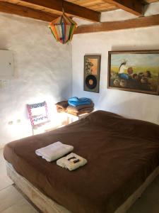 a bedroom with a large bed in a room at REMODELAMOS casa sobre el rio a 100 mts del mercado municipal in Tilcara