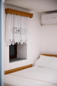 Postel nebo postele na pokoji v ubytování Guesthouse Çani