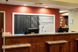 a lobby with a large window with the word explore at Hampton Inn & Suites Baton Rouge - I-10 East in Baton Rouge