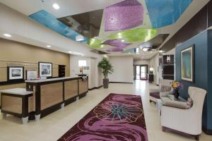 a hospital lobby with a purple and green ceiling at Hampton Inn and Suites Missouri City in Missouri City