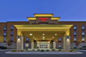 a front view of a hotel with a sign on it at Hampton Inn Sedalia in Sedalia