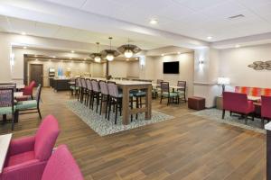 a large dining room with a table and chairs at Hampton Inn Sedalia in Sedalia