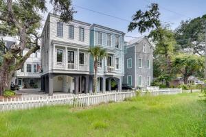 a large house with a white fence at Lovely Mt Pleasant Townhouse with Central Location! in Charleston