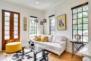 a living room with a couch and a table at Lovely Mt Pleasant Townhouse with Central Location! in Charleston