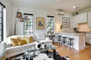 a living room with a couch and a kitchen at Lovely Mt Pleasant Townhouse with Central Location! in Charleston