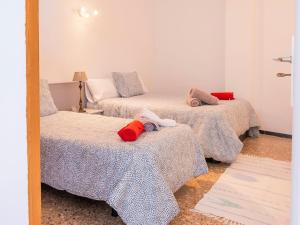 A bed or beds in a room at Live Tenerife La Barranquera con vistas al mar