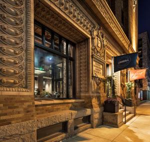 a store front of a building with a window at Canopy by Hilton Minneapolis Mill District in Minneapolis