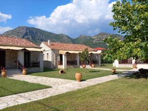 a house with mountains in the background at Villa Maria 3 in Gliki