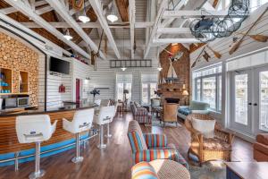 a lobby with chairs and a bar in a building at Hilton Grand Vacations Club Blue Mountain Canada in Blue Mountains