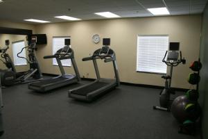 a gym with several tread machines in a room at Hampton Inn La Grange in La Grange