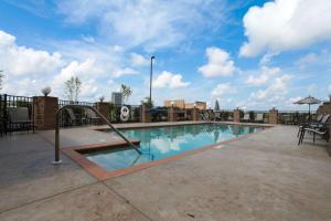 a swimming pool on top of a building at Hampton Inn - Atmore in Atmore