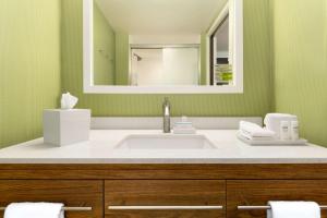 a bathroom with a sink and a mirror at Home2 Suites By Hilton-Cleveland Beachwood in Beachwood