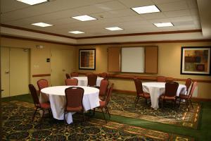 a conference room with tables and chairs in it at Hampton Inn Clinton in Clinton