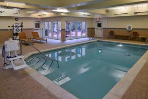 a large swimming pool in a hotel room at Hampton Inn & Suites Tacoma in Tacoma