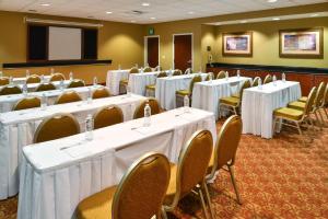 a conference room with white tables and chairs at Hampton Inn & Suites Tacoma in Tacoma +15 photos