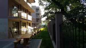 a row of benches in front of a building at Hotel Vega in Kranevo