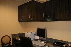 an office desk with a computer and a printer at Hampton Inn & Suites McAlester in McAlester