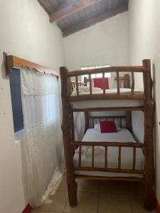 a bedroom with two bunk beds in a room at Hostal Blood Moon in Rio Dulce