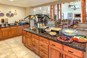 a kitchen with a counter with bowls of food on it at Homewood Suites by Hilton Santa Fe-North in Pojoaque