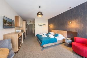 Posteľ alebo postele v izbe v ubytovaní Apartamenty Diva Kołobrzeg