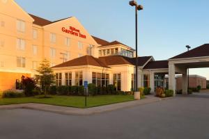 a hotel building with a parking lot in front of it at Hilton Garden Inn Shreveport in Shreveport