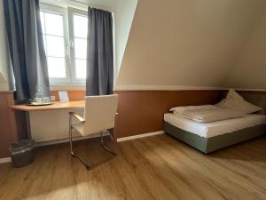 Postel nebo postele na pokoji v ubytování Hotel Bremer