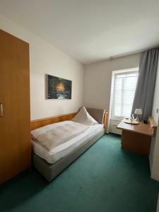 Postel nebo postele na pokoji v ubytování Hotel Bremer