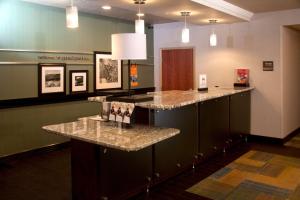 a bar in a hospital room with granite counter tops at Hampton Inn Grand Junction in Grand Junction