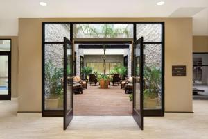 an open door in a building with a lobby at Hilton Garden Inn Rochester Downtown, NY in Rochester