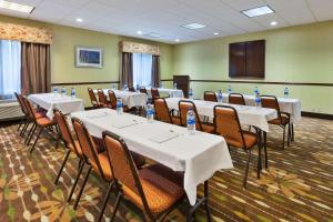 a conference room with tables and chairs with water bottles at Hampton Inn Waterbury in Waterbury