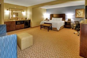 a hotel room with a bed and a bathroom at Hampton Inn Jonesville/Elkin in Arlington
