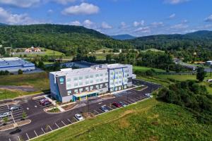 an aerial view of a building with a parking lot at Tru By Hilton Roanoke Hollins in Roanoke