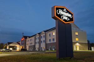 a sign for a hampton inn in front of a building at Hampton Inn Bangor in Bangor