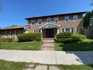 a brick house with a front door and a driveway at Lovely house in a nice community in Toronto