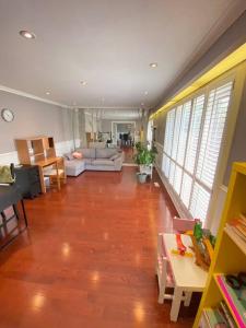a large living room with a hard wood floor at Lovely house in a nice community in Toronto