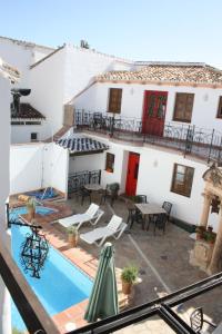 a view of a house with a swimming pool at Apartamentos La Ciudad in Ronda