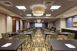 a classroom with tables and chairs in a room at Hampton Inn and Suites Camp Springs in Camp Springs