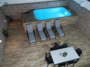 an overhead view of a pool room with a table and chairs at Villa Jara 25 in Nerja