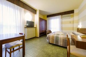 Postel nebo postele na pokoji v ubytování Hotel Reale